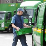 droghedapostmanjohnwoodsloadsatrayofmailintohispostvan