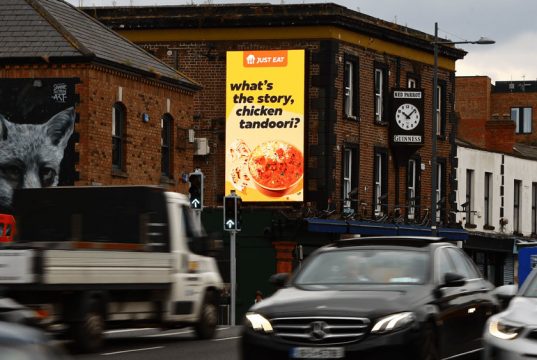 Just Eat Serves Up Tasty OOH Wordplay Before Oasis Gigs